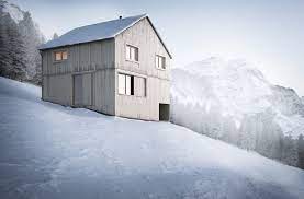 The home is built on a concrete base, with one side partially submerged into the. House In Fontanella On Behance
