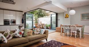 The kitchen and dining areas are linked by a high breakfast bar. A Savvy Renovation Creates An Open Plan Kitchen Diner Houzz Uk