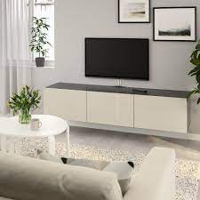 besta tv unit with doors black brown selsviken high gloss beige 70 7 8x16 1 2x15 buy online or in store ikea in 2021 tv bench tv unit wall mounted tv unit