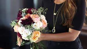Use floral tape to wrap the bouquet stems tightly. How To Make A Wedding Bouquet Youtube