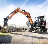 Develon | Mini Wheel Excavator | Model DX100W-7 | Dig Depth 13' 11" | 100.6 hp | 12.6 Tons | For Compact Excavation & Urban Construction