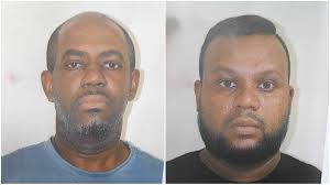 Two officers charged with taking money to speed up firearm applications