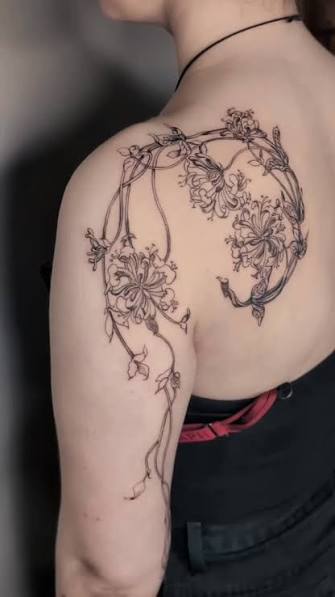 Delicate linework and botanical details for this custom shoulder wrap by @tash_tatts