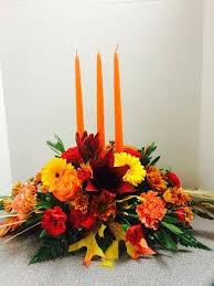 Long And Low Centerpiece With 3 Orange Candles Orange Roses Carnations Leaves Red Lilies M Orange Flower Bouquets Thanksgiving Floral Thanksgiving Flowers