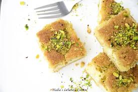 Maamoul Mad Bil Ashta A Specialty That Has Clotted Cream Ashta Incased In A Semolina Butter Cake Flavore Clotted Cream Moroccan Food Orange Blossom Water