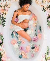 Mix flower petals and leaves in milk bath, background or texture for massage and spa, relax. How To Take Milk Bath Maternity Photos