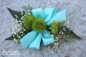 How to easily make a homemade boutonniere out of flowers. How To Make A Wrist Corsage Or Boutonniere With Fresh Flowers