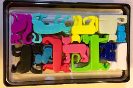 Build a puzzle solution between the red. Brainwright Cat Stax Dog Pile Review Room Escape Artist