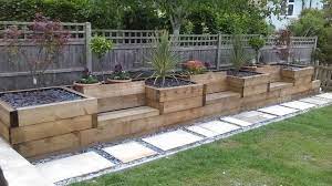 How to build a raised patio with retaining wall blocks. The Coziest Outdoor Seating Ideas Diy Garden Seating Building A Raised Garden Sloped Garden