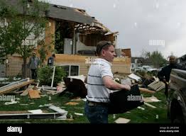 David Strathman loads some of his posessions into a pick-up after his  apartment was hit by a tornado in Windsor, Colo., Thursday, May 22, 2008.  (AP Photo/Will Powers Stock Photo