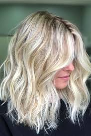 For a longish face, split the long hairs from one side. Blonde Hairstyles How To Style Blonde Hair With Curtain Bangs