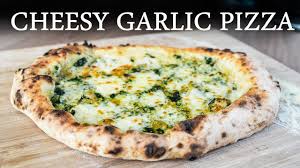 Prepare pizza sauce (recipe follows) and pour sauce on top of cheese. No Music Easy Cheesy Garlic Bread Pizza Recipe In The Pizza Oven Roccbox Pizza Oven Recipes Youtube