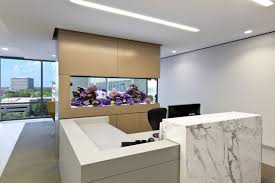Aquariums have been designed to create a moody feel near the sushi bar. Aquarium Design Group