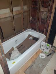 Before you begin the bathtub installation, check the tub rim for level, both front to back and side to side (photo 7). Shimming Studs For Tub Surround