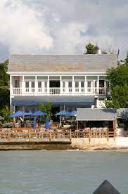 Louie S Backyard So Delicious Shrimp With Spicy Quinoa Crab Cake With Fruit Slaw Conch Fritters And Yuca Plantain Nachos Key West Florida Florida Keys