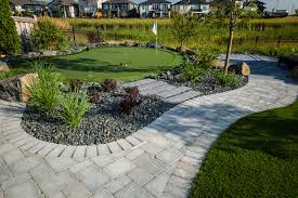 Roman pavers around pool with black ornamental fence. Roman Paver Barkman Concrete Winnipeg Greenhouses And Garden Centre Barkman Concrete Winnipeg Manitoba Ron Paul Garden Centre