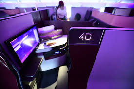 Qatar's qsuite business class features enclosed suites, with sliding doors that you can close for privacy. Flying The Qatar Airways Qsuite Business Class 777 300er From Dallas To Doha The Monsoon Diaries