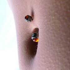 Dip your cotton swabs or balls into cleaning solution and gently begin clean the area around your piercing, removing all discharge and debris that might have begun building up. Navel Piercing Tips And Aftercare Tatring