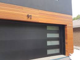 Window Position Can Make A Flush Door Contemporary We Love This Layout For Any Home Looking For A Black Do Garage Door Design Modern Garage Doors Garage Doors
