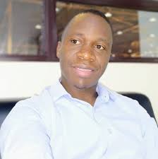 Steve Crossman is just leaving the office bound for Equatorial Guinea. He  is proudly showing off his black folder full of fascinating facts about  AFCON. He let us have a liitle peak