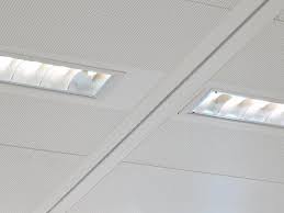 Drop the ceiling panels into position by tilting them slightly, lifting them above the framework and letting them fall into place. Suspended Metal Ceilings Sas