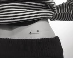 Tiny Birds On A Wire Tattoo Bird And Wire Tattoo On The Lower Back Small Tattoos Tattoos Badass Tattoos