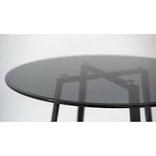 It measures 18'' h x 36'' l x 36'' w, and arrives ready to use, with no assembly needed. Akira Round Glass Dining Table 110cm Smoked Glass Top Black Legs Buy Dining Tables 0765453524083