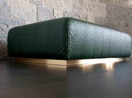 The contemporary square ottoman can be used as a coffee table in the living room. Dentro Home Viarreggio Woven Leather Coffee Table Ottoman