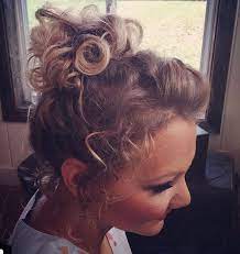 Made By Creating A High Top Ponytail And Then Arranging The Ends Loose Strands Frame The Face And The Front Spo Curly Hair Updo Curly Hair Tips Curly Hair Up