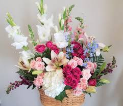It makes for quite a charming presentation! Spring Basket Of Blooms In Baton Rouge La Blushing Blooms Florist