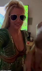 Britney Spears rings in 42nd birthday at pal Cade Hudson's house... but has  to rush new puppy Snow