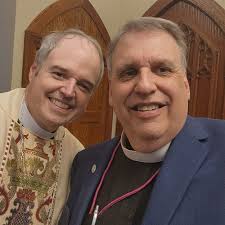 The congregation erupted in joy as Bishop Doug Scharf announced, "Let us  now welcome the newest priest in God's Holy Church," last night at Christ  Church of Bradenton, as the Rev. William