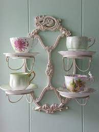 Tea cup and saucer display in wall shelves. Cup Saucer Holder Tea Cup Display Tea Cups Vintage Vintage Tea