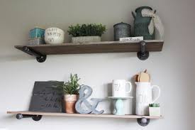 The tiles and cabinets are white. Diy Project How To Build Pipe Shelves The Holtz House
