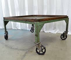 Drill equipped with drill and driver bits to fit screws. Antique Iron Industrial Coffee Table With Casters And Original Wood Top City Girl Arts
