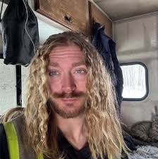 Why is a person hanging from a helicopter?