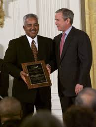 President George W Bush Stands With Thornton Stanley Of Stanley Construction Huntsville Alabama Who Holds His