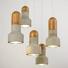 Concrete Pendant Light Such Such Such Such The pendants of the material family all share the same shape, but the materials vary from wood and metal to marble, ceramic and concrete.