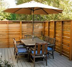 Design ideas for a large modern full sun and rock front yard concrete paver formal garden in denver for summer. Modern Privacy Fence Ideas For Your Outdoor Space