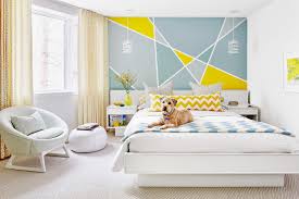 Create An Abstract Accent Wall Design With Just A Roll Of Painter S Tape And A Few Quarts Of Color Geometric Wall Paint Bedroom Wall Wall Paint Designs