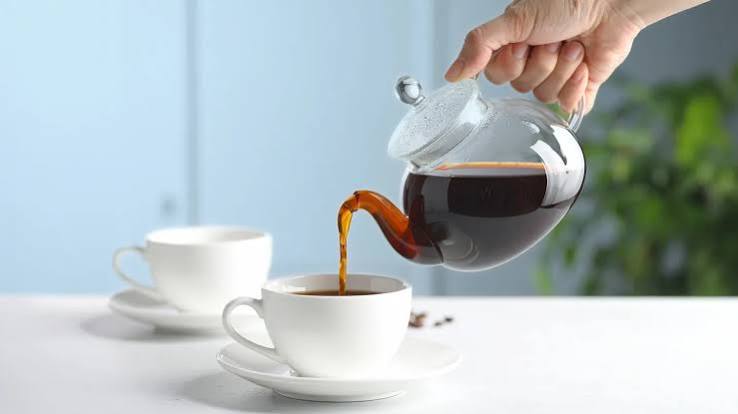 Medical infographic showing caffeine interfering with medicine absorption in stomach and intestines