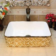 luxury ceramic washbasin gold and white
