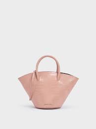 Find everything from crossbodies, purses, handbags, totes and travel options. Pink Croc Effect Trapeze Tote Charles Keith International