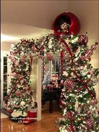 Create the perfect christmas at your home this year with christmas decorations from oriental trading. The Arch Is Beautiful But What Is The Thingy Above The Garland Christmas Tree Arch Christmas Themes Decorations Christmas Door Decorations