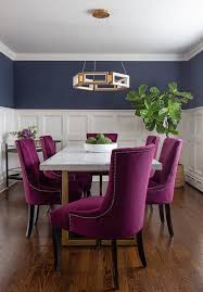 Fuchsia Velvet Dining Chairs Surround A Marble And Brass Dining Table Under A Brass Geometric Velvet Dining Room Chairs Velvet Dining Chairs Brass Dining Table