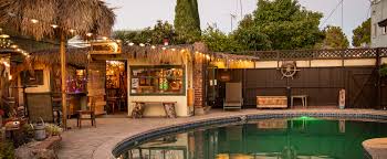Check in to the long beach resort for an exhilarating stay, just beyond the famed sandy beaches of galle and unawatuna. Vintage Backyard W Tiki Bar Swimming Pool And Pond Long Beach Ca Production Peerspace