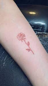 Red ink flower small hand tattoo mia.mk3/instagram . Dainty Rose Tattoo Pink Tattoo Pink Rose Tattoos Red Ink Tattoos