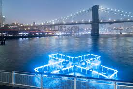 The city's economic development corporation is seeking ideas for a floating pool that would filter the the project would not be the first floating pool to open in new york city. A Glowing Cross Is Floating On Manhattan S East River The Spaces
