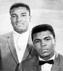 Muhammad Ali and his brother Rahman Ali, walk with their great-grandmother  Betsy Jane Greathouse, who was 99 when this picture was taken in  Louisville, Kentucky, circa 1963.