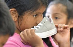 Photos: 100 students at Robert Bruce Elementary receive new shoes